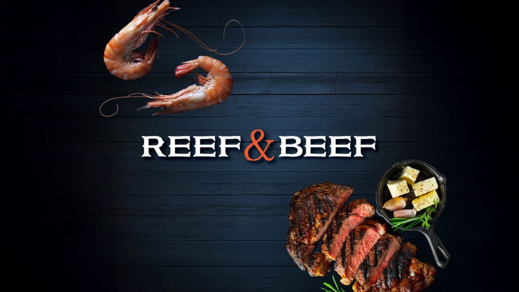 Grilled steak and seafood displayed on a dark background